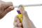 'Close-up of a person stripping a cable with a tool.'