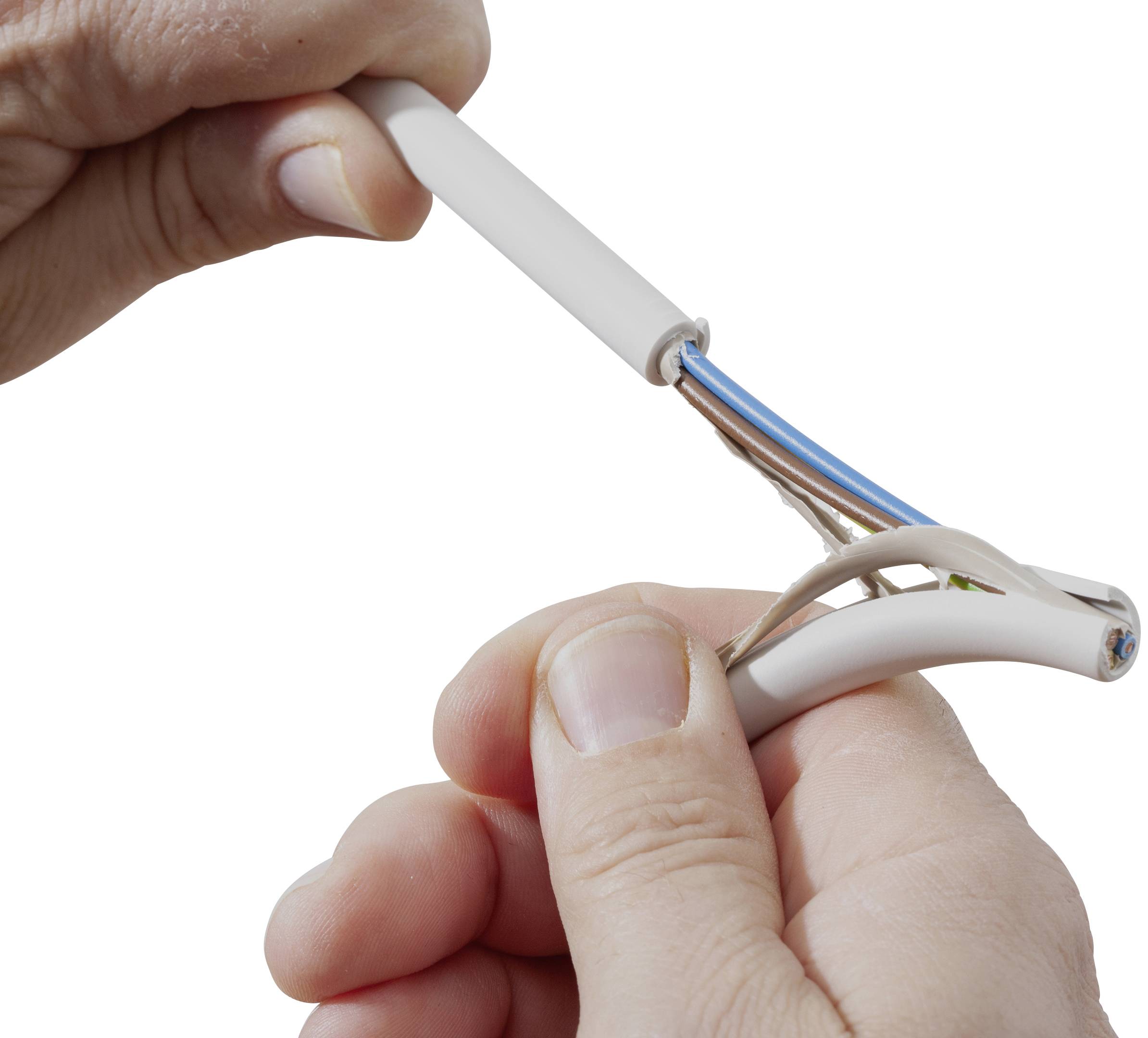 A person strips cable insulation to reveal the inner cables. Hands hold the cable and wire stripping tool. Focus on blue and brown coloured wires.