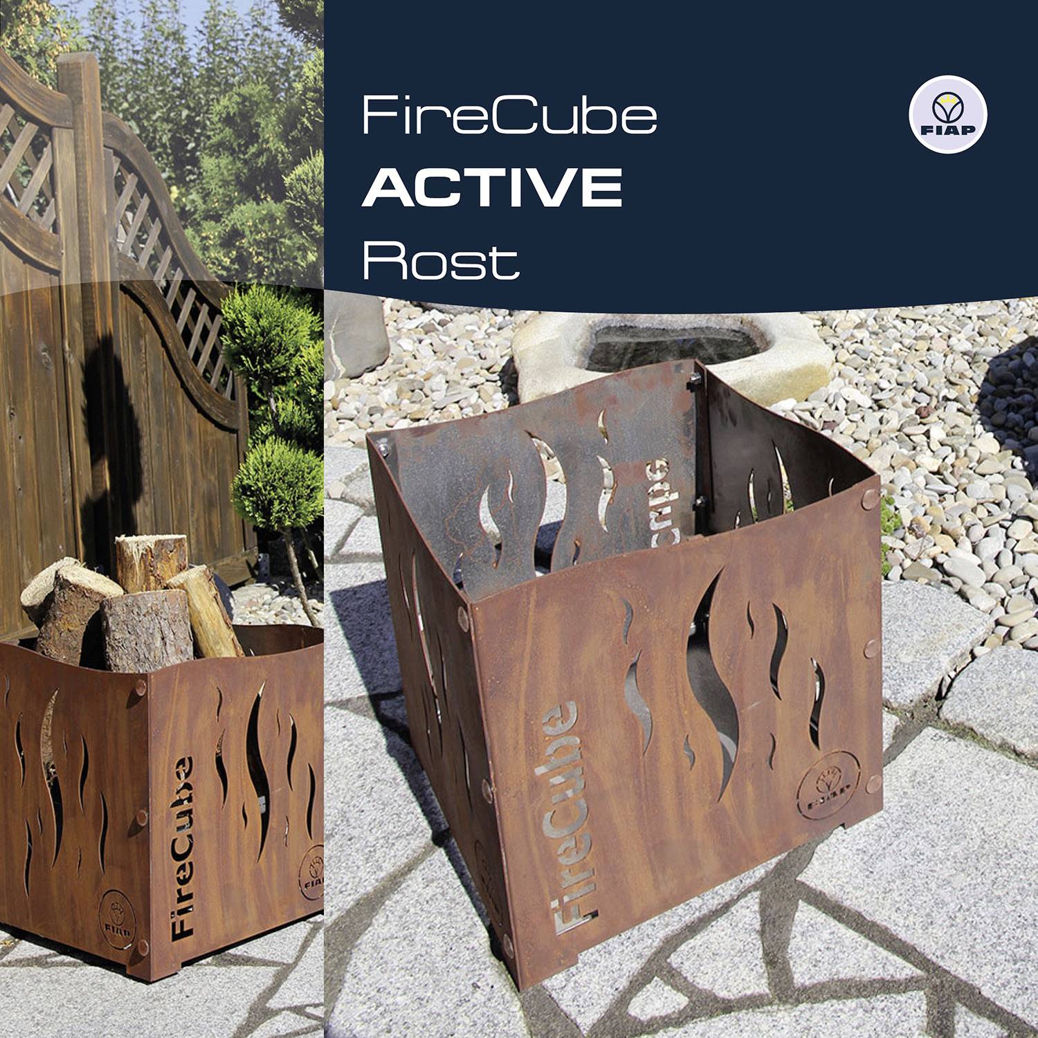 'FireCube ACTIVE Rust' metal fire pit beside a wooden fence, filled with logs of wood. Stone garden in the background.