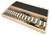 Wooden storage case holding a set of metal woodworking drill and router bits arranged in slots.<br>
