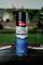 A can of Caramba Auto Power Protect underbody protection spray on a workbench with tools in a garage setting.
