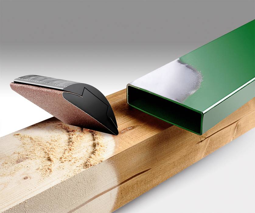 A planer blade smoothing wood, with a green metal box cutter shown beside illustrating its use for woodworking finishes.