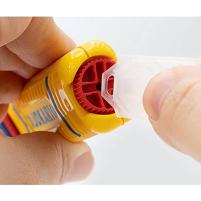 Two hands assembling a yellow plastic safety device with a red wheel and a clear cap, close-up view showing precision.