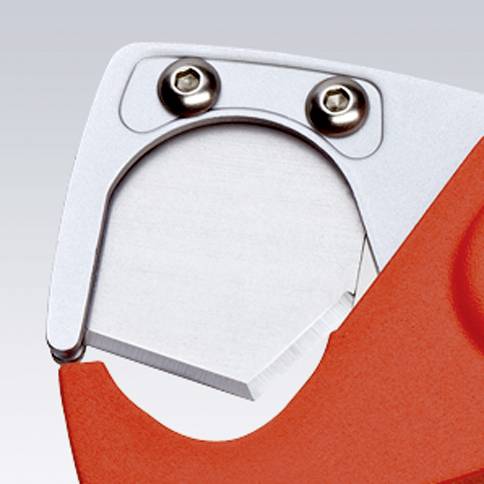 Close-up of a silver tin snips on a red background, showing the sharp blade and two screws for securing the mounting bracket.