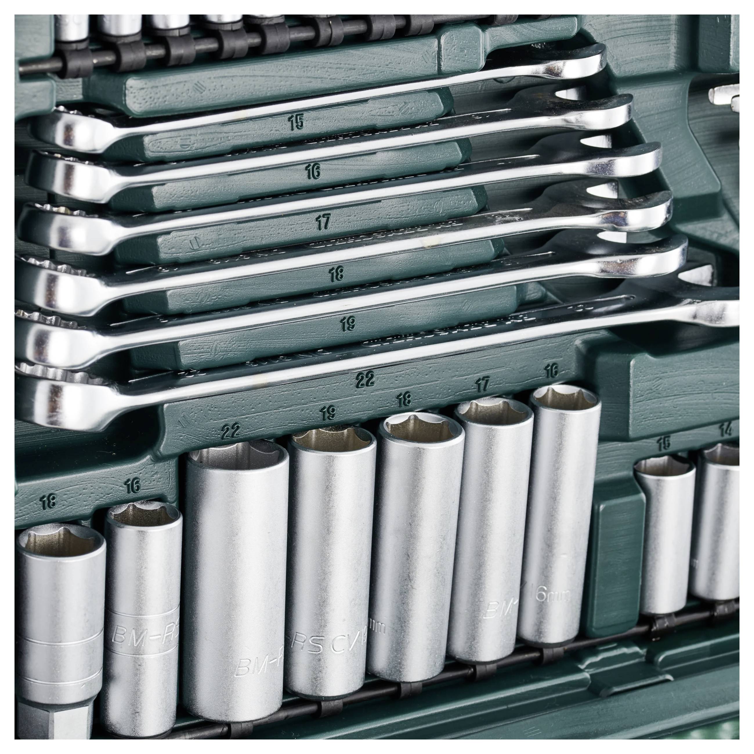 'Set of spanners and sockets in a green toolbox, various sizes from 10 to 22 mm, organised.'