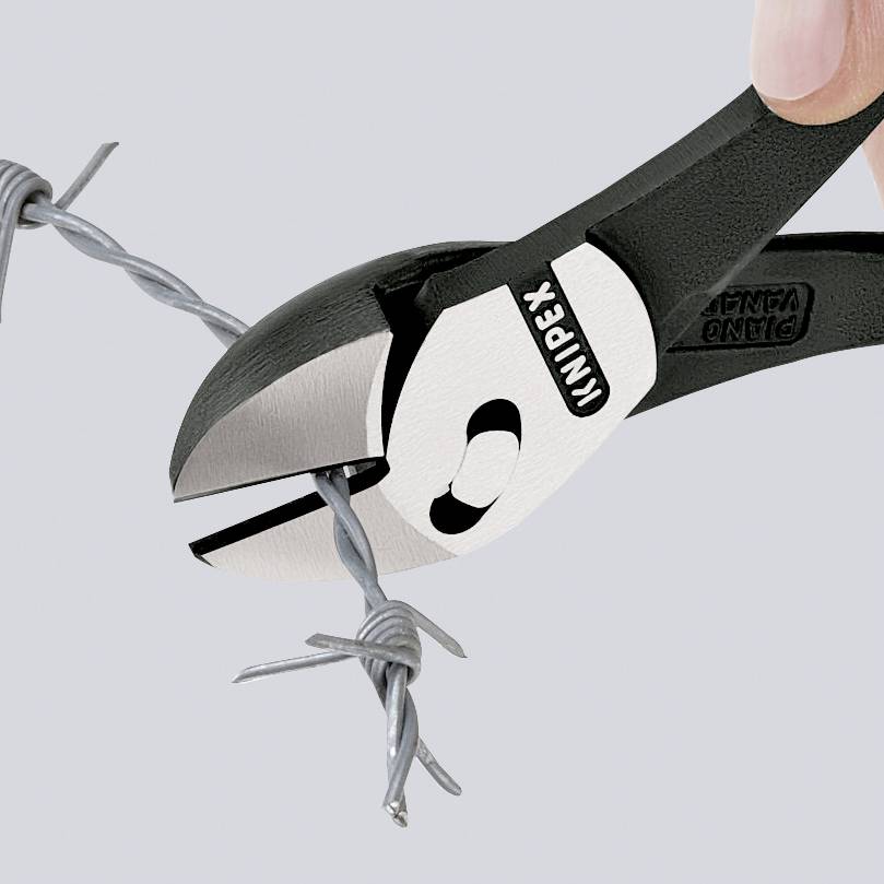 A hand holds pliers and cuts through barbed wire.