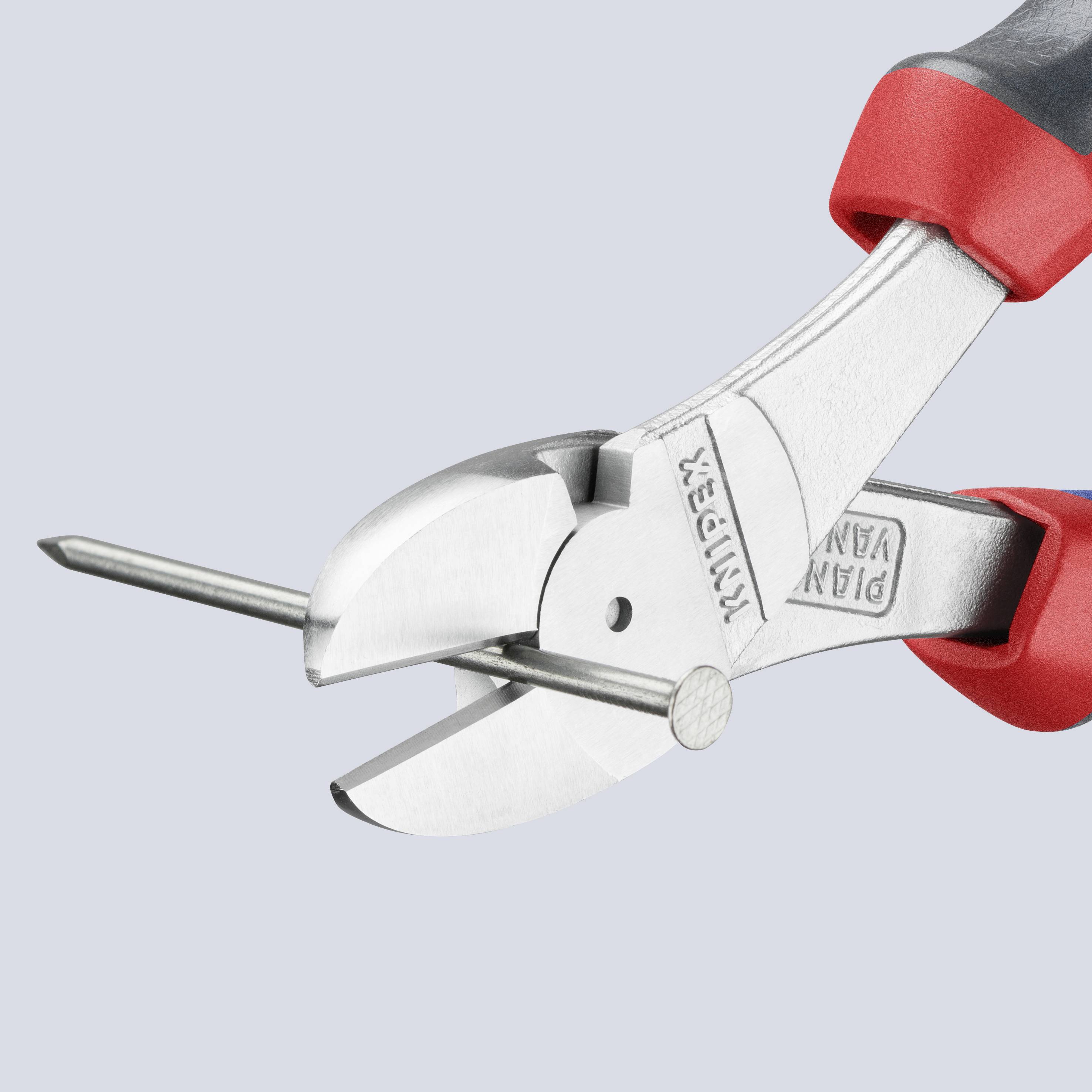 Side cutters with red and black handle cutting a wire. Suitable for electricians or DIY work.