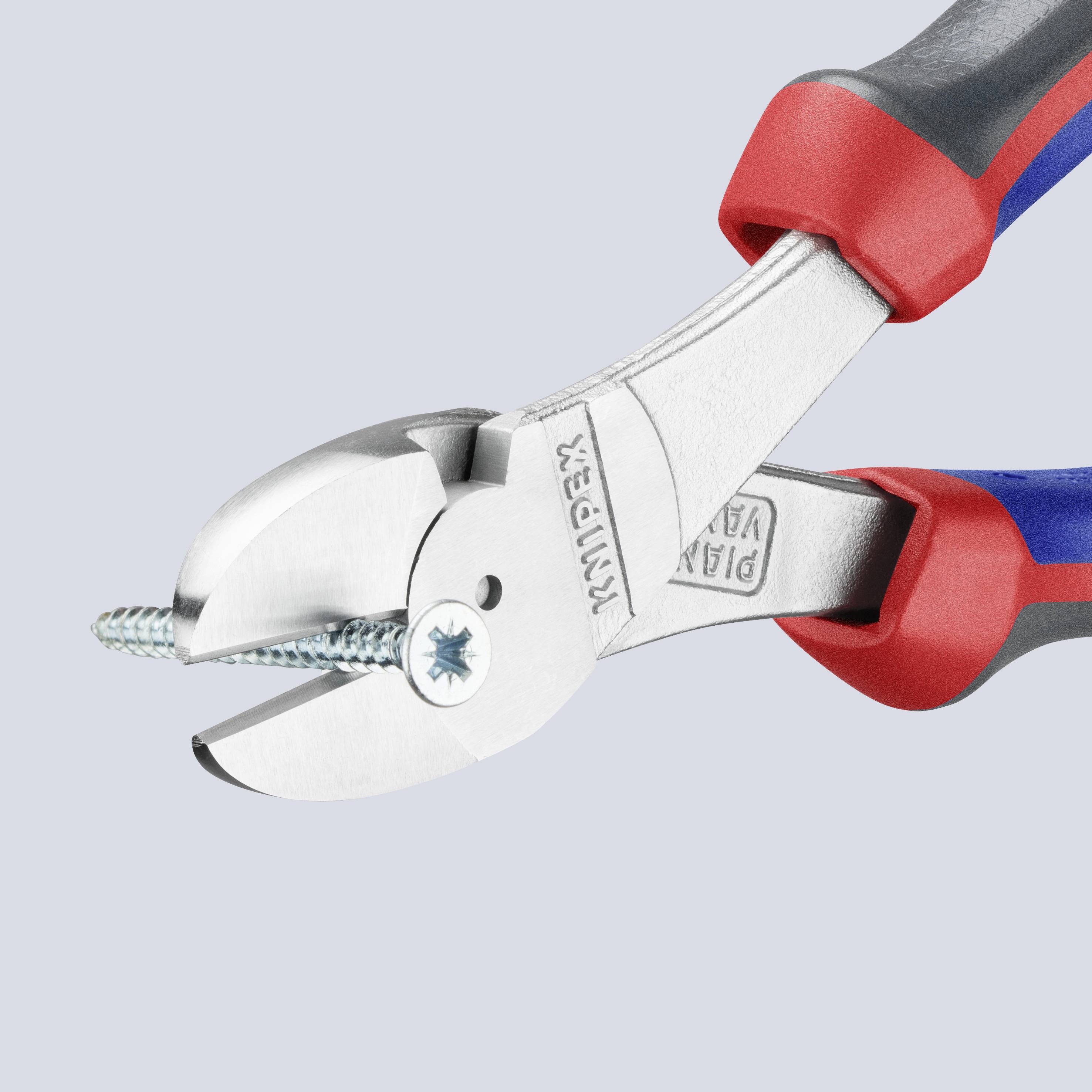 A red and blue pair of pliers cuts a screw. The pliers are robust and manufactured from metal, suitable for precise cutting.