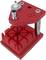 'Red metal watchmaker's tool holder with grooved base and holding devices for small tools and screwdrivers.'