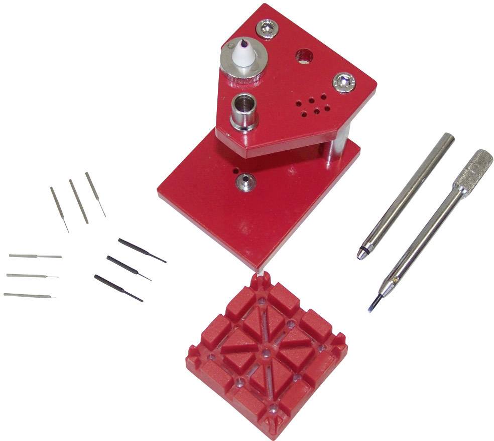 Red watchmaker's tool set with holder, screwdrivers, pins and punch plate, for fine adjustment of watch movements.