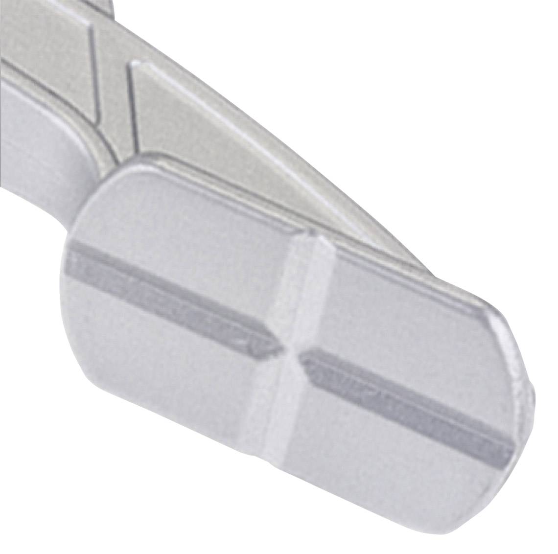 Metallic-looking object with structured edges and grooves. Purpose unknown.