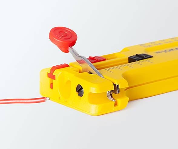 A yellow cable stripping tool showing a close-up of a wire being stripped, with a red adjuster and measuring guide visible.