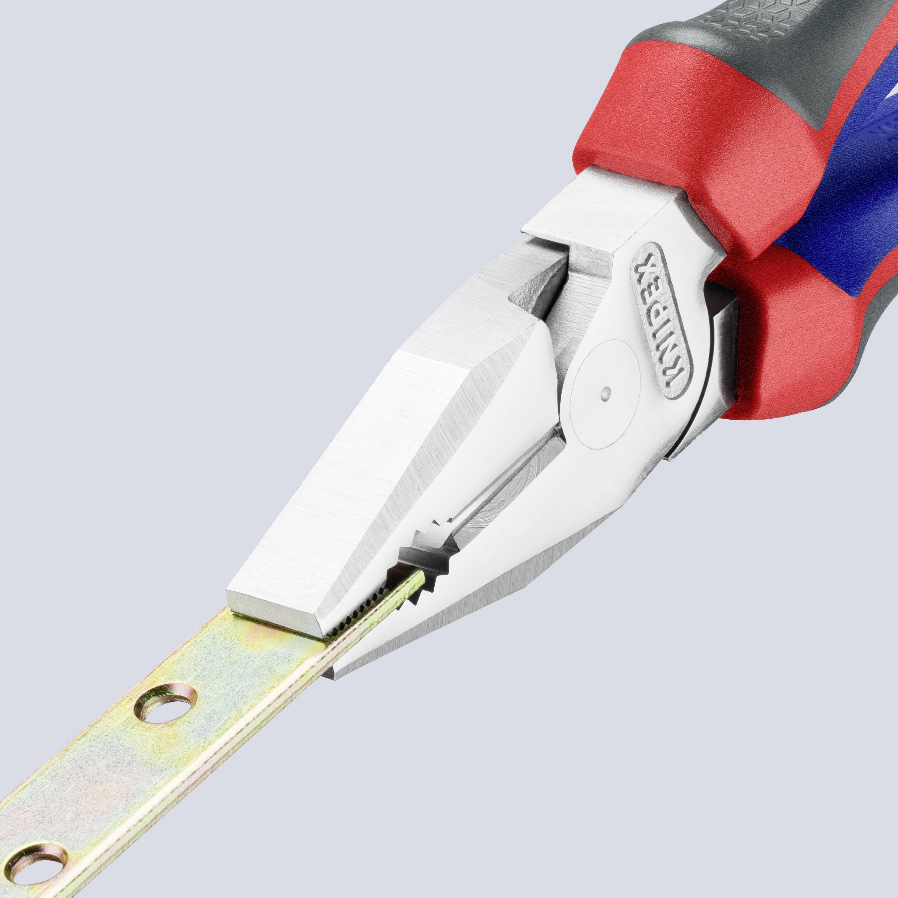 A pair of pliers is holding a thin, perforated metal piece. The pliers have red and blue handles and are labelled as a tool.
