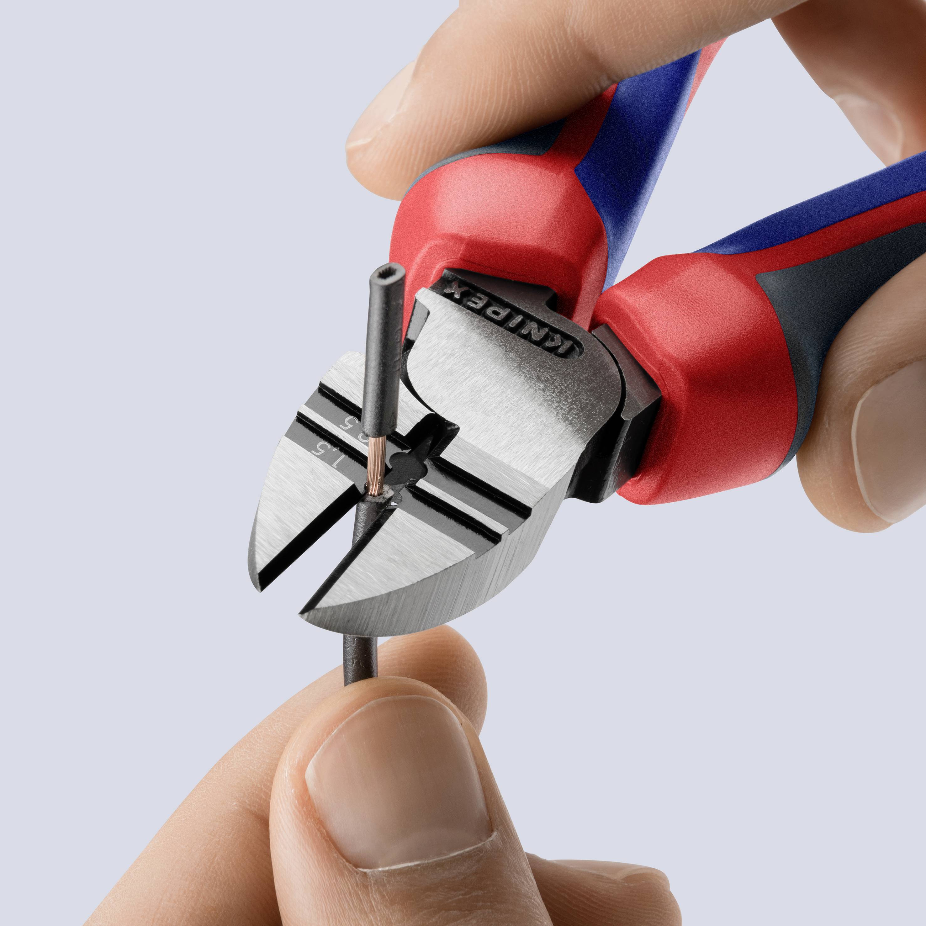 'Close-up of hands using side cutters to cut a thin metal rod. The background is grey.'