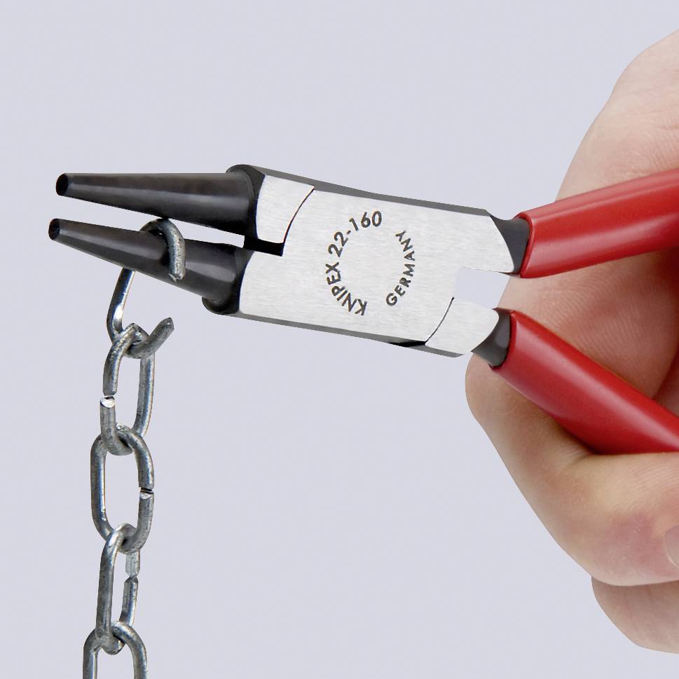 A hand holds a red pair of pliers, bending a chain link while preserving the chain's integrity.