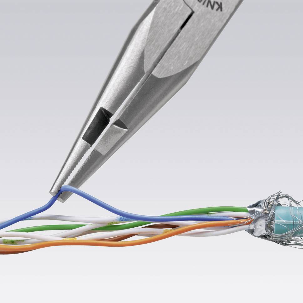 A silver pair of pliers cuts coloured wires: blue, orange, green, white. The pliers are positioned diagonally across the wires.