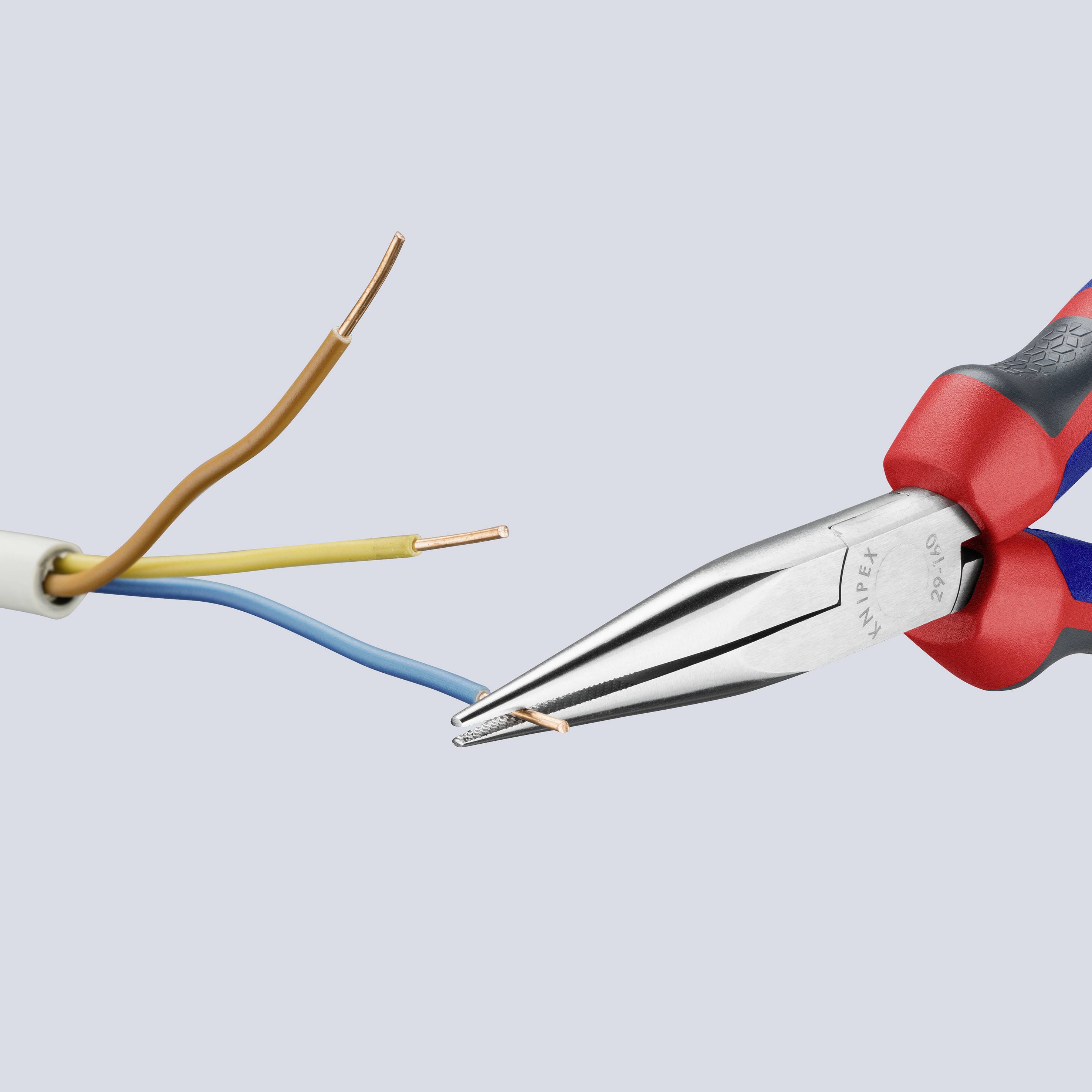 A pair of pliers with insulated handles is cutting a multi-core cable. Three exposed wires are visible: brown, blue, and copper-coloured.