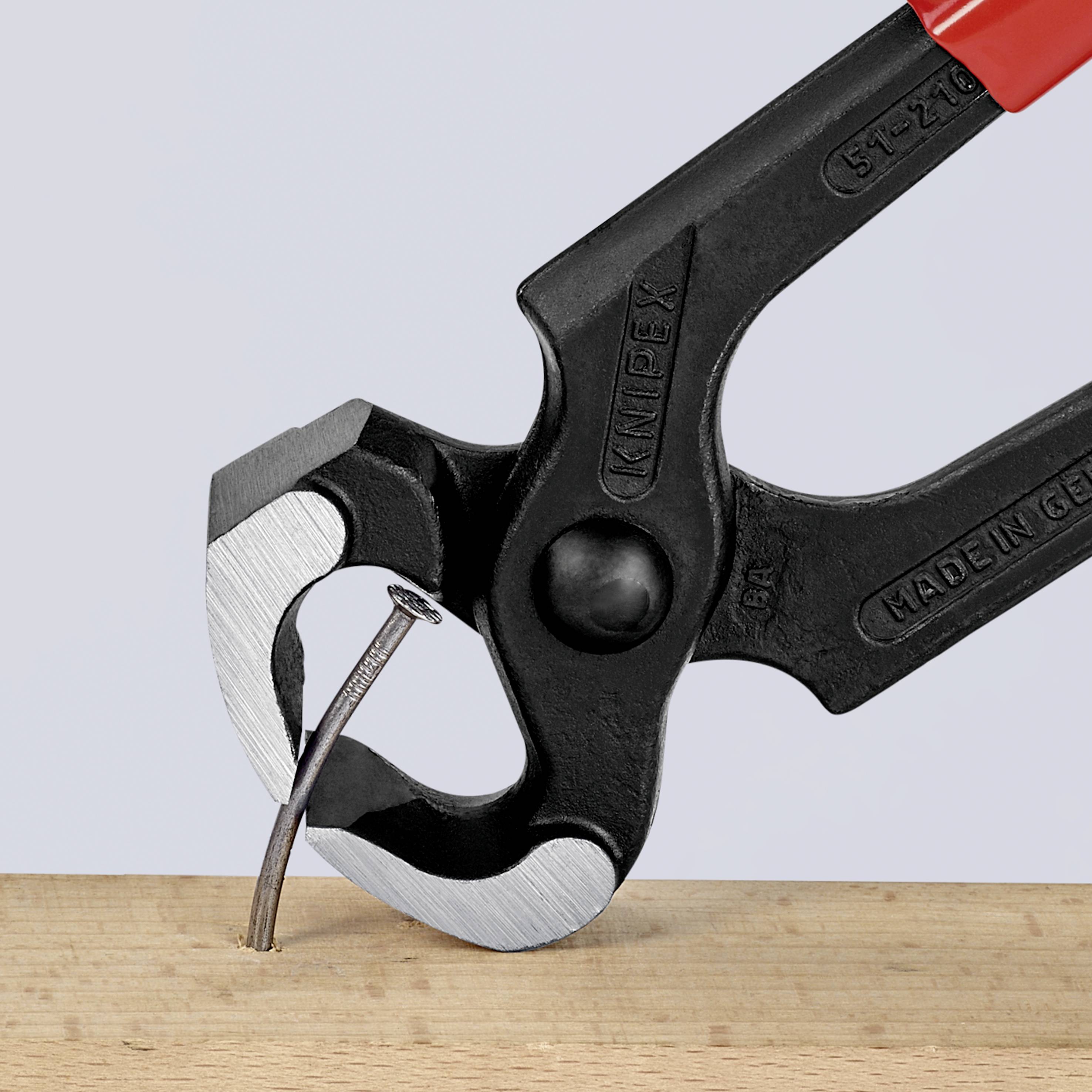 A black pair of pliers pulls a nail out of a wooden board. The inscription 'Made in Germany' is engraved on the pliers.