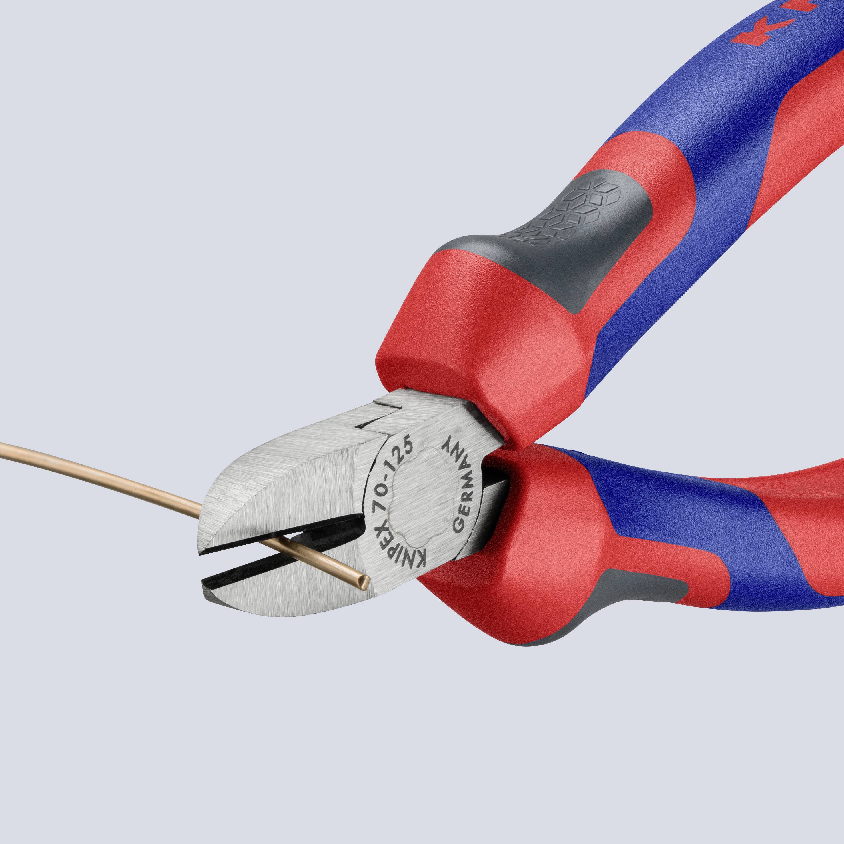 A wire cutter slices through a thin copper wire. The tool has red and blue handles.