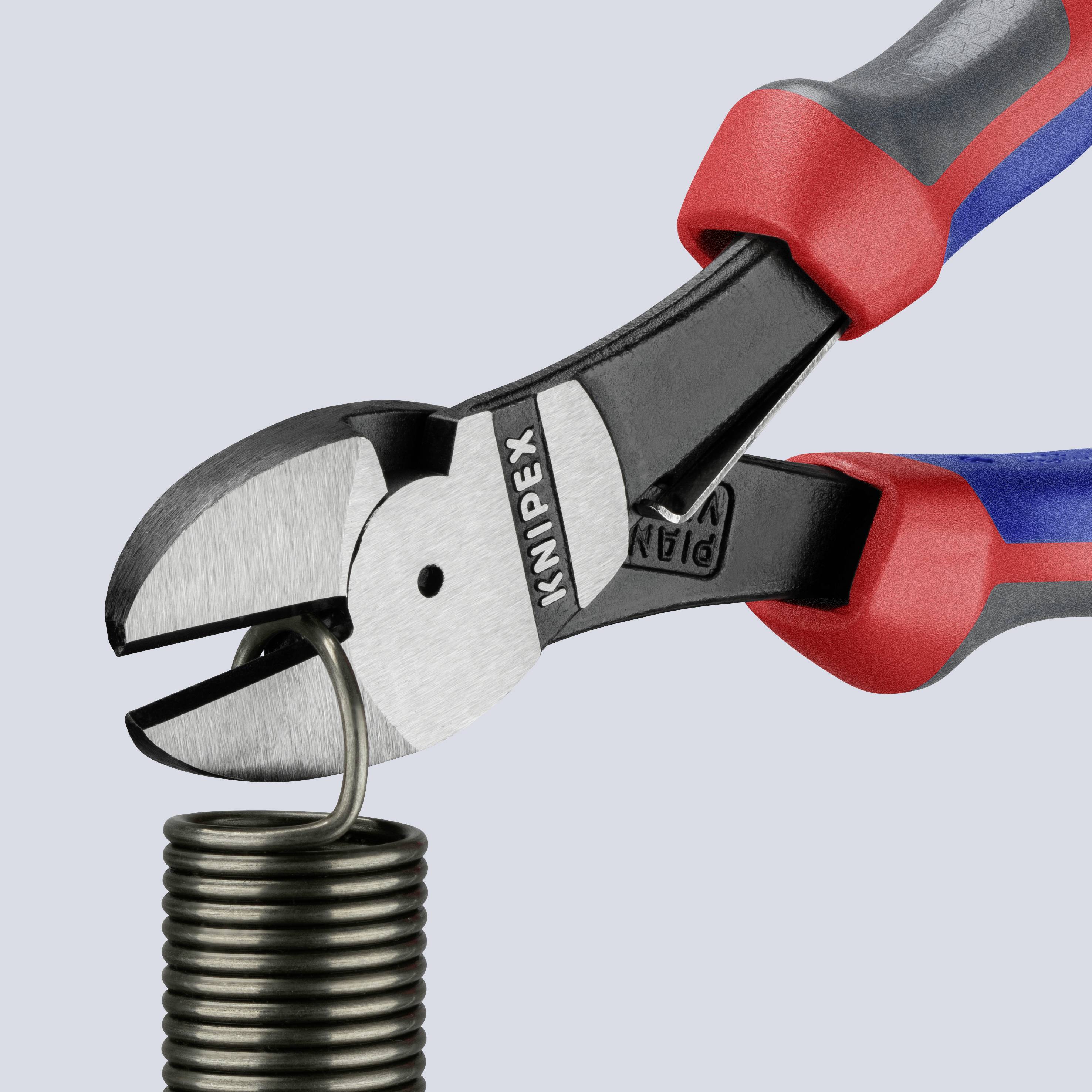 'Pliers cut a wire loop.' A black, shiny wire is being cut by the red and grey pliers.