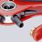 Close-up of a red multi-circuit brake valve with black connections, part of a pneumatic braking system.