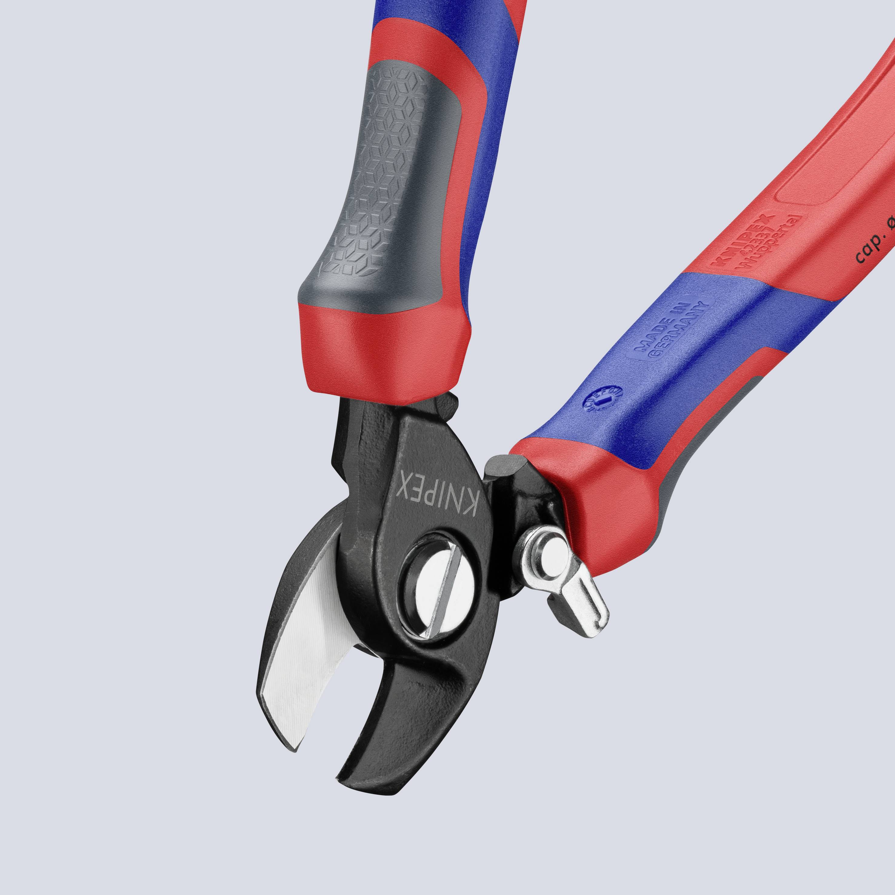 Pliers with red and blue handles and silver cutting blades on a grey background. Suitable for cutting cables or wires.