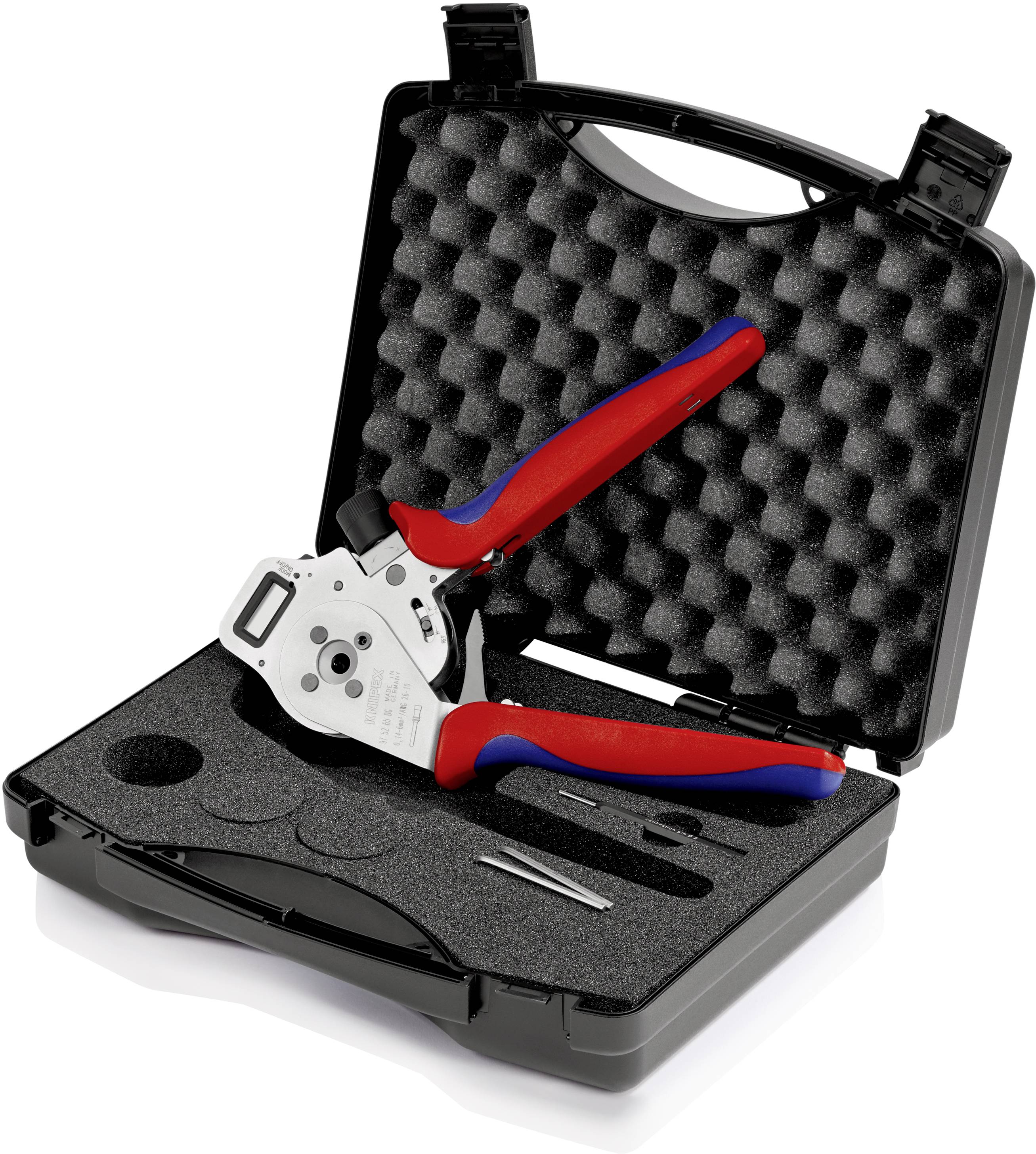 An open case with a crimping tool, two spare blades and a pair of tweezers, set on a foam insert for secure storage.