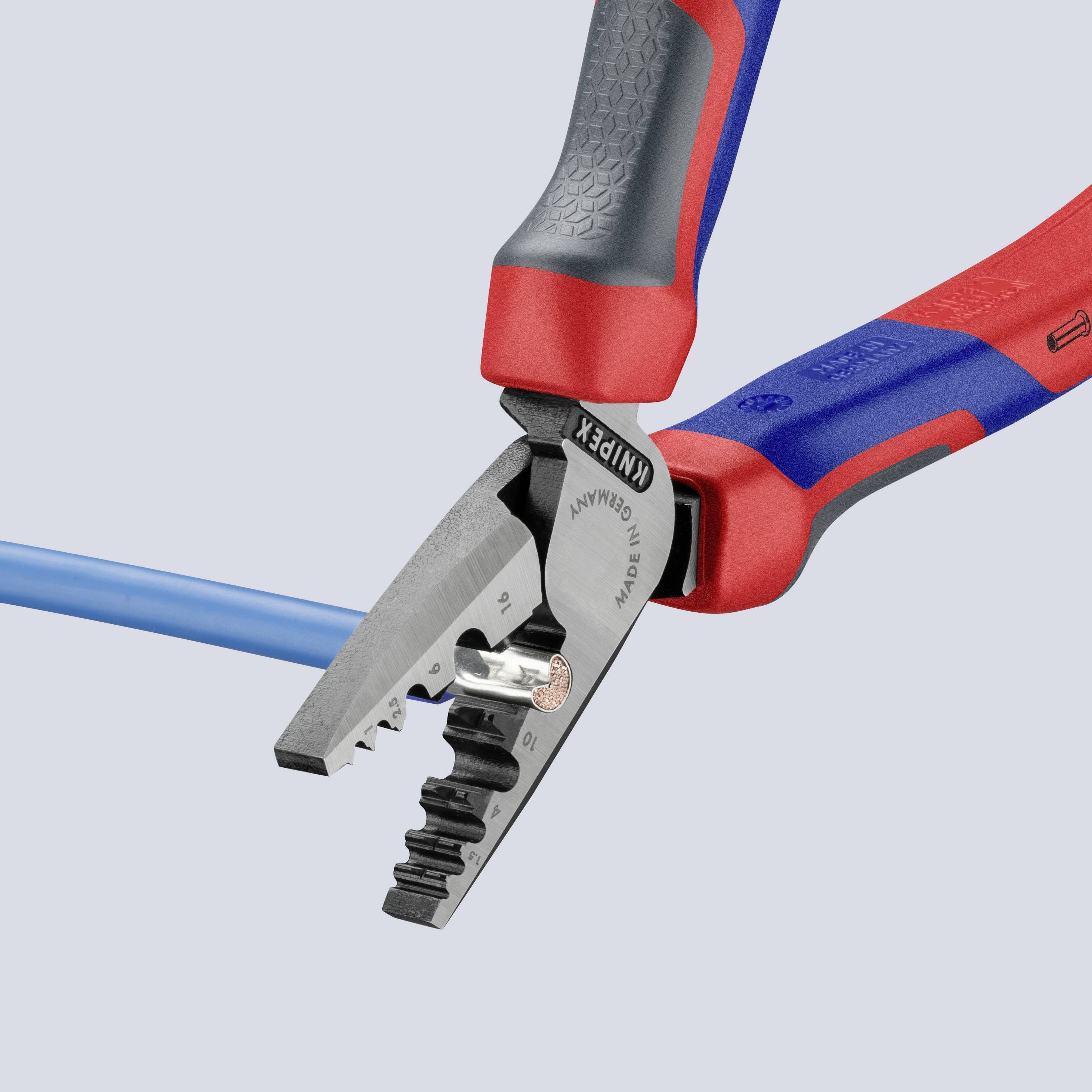 A pair of pliers with a blue cable is being cut. The pliers have a red and black handle.