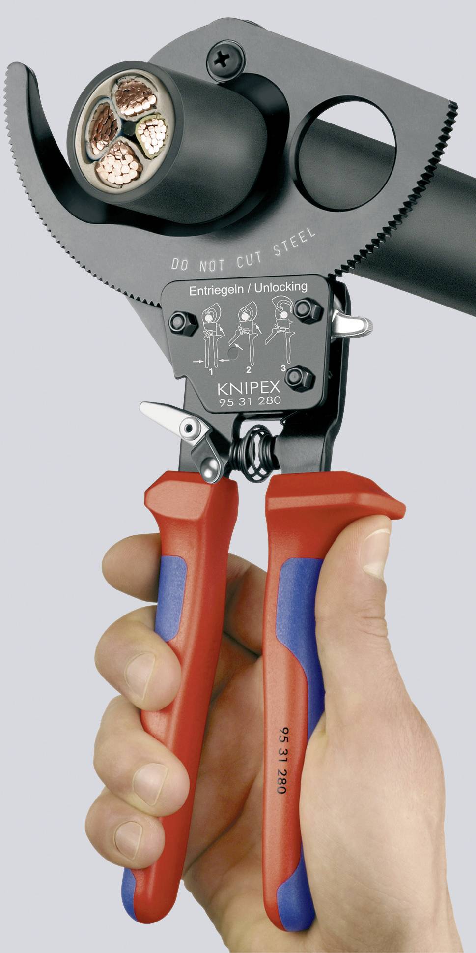 A hand holds Knipex wire cutters, cutting a thick cable. Text on the tool explains unlocking. Used in electrical engineering.