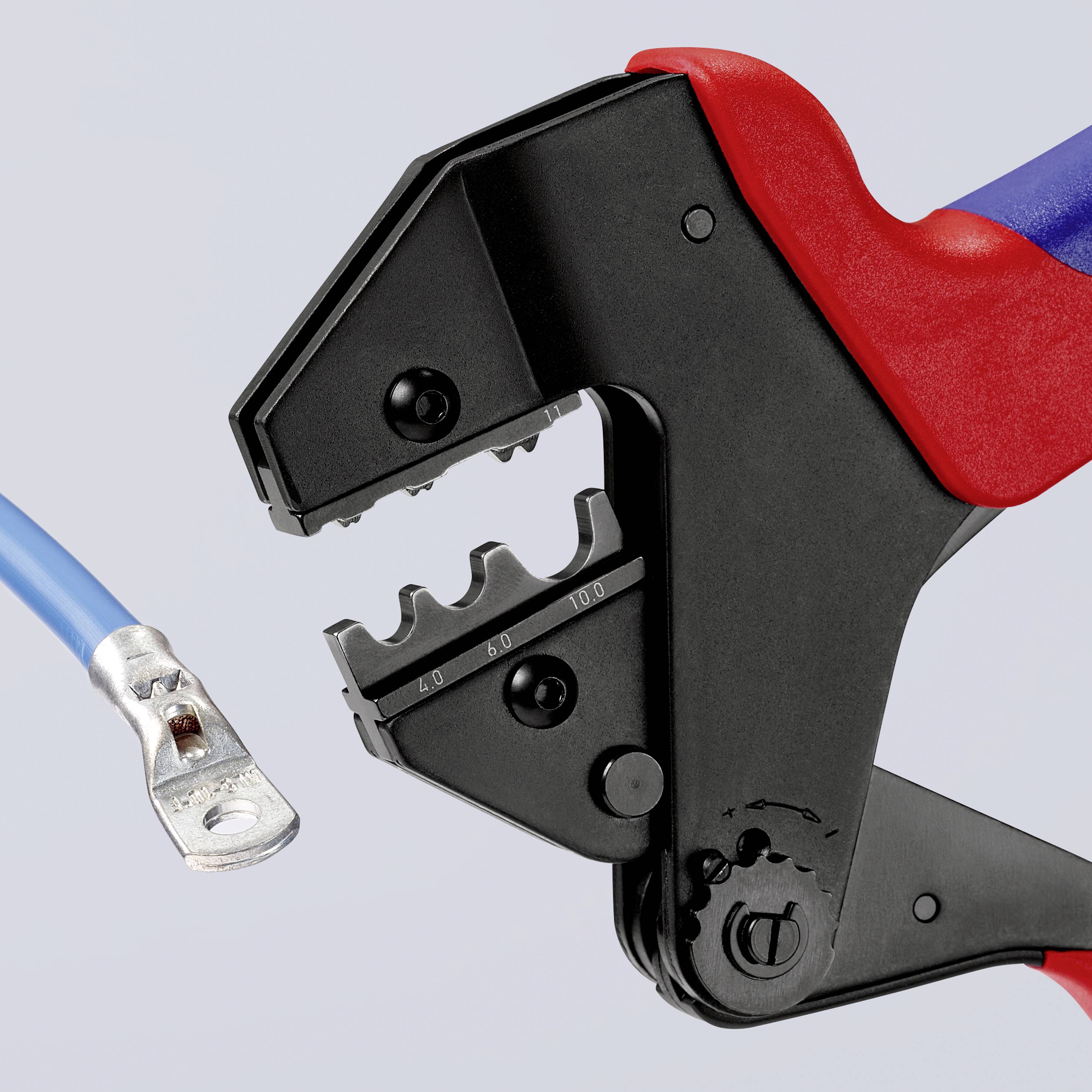 Close-up of a blue cable with a clamp and a crimping tool with a blue and red handle, currently working on the cable.
