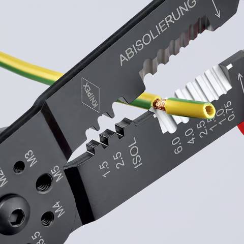 Wire stripper tool in use, removing insulation from a yellow and green cable. The tool's marked measurements guide precision.