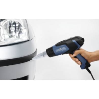 A hand is holding a hot air blower against the corner of a car, presumably to heat up or repair an area.