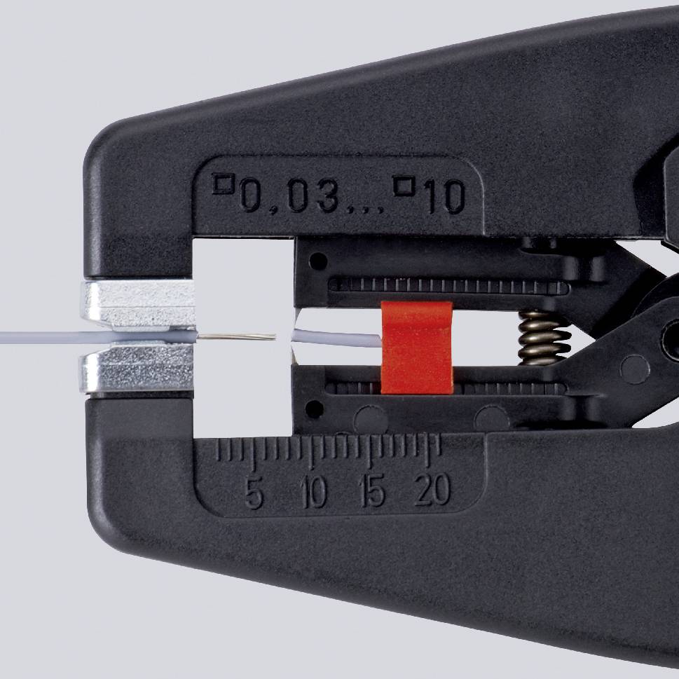 A wire stripper precisely removes the insulation from a cable. Scales on the pliers indicate measurements from 0.03 to 10.