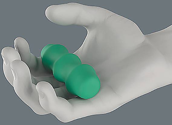 A gray hand holds a small green massage roller with three connected segments, highlighting its compact and ergonomic design.