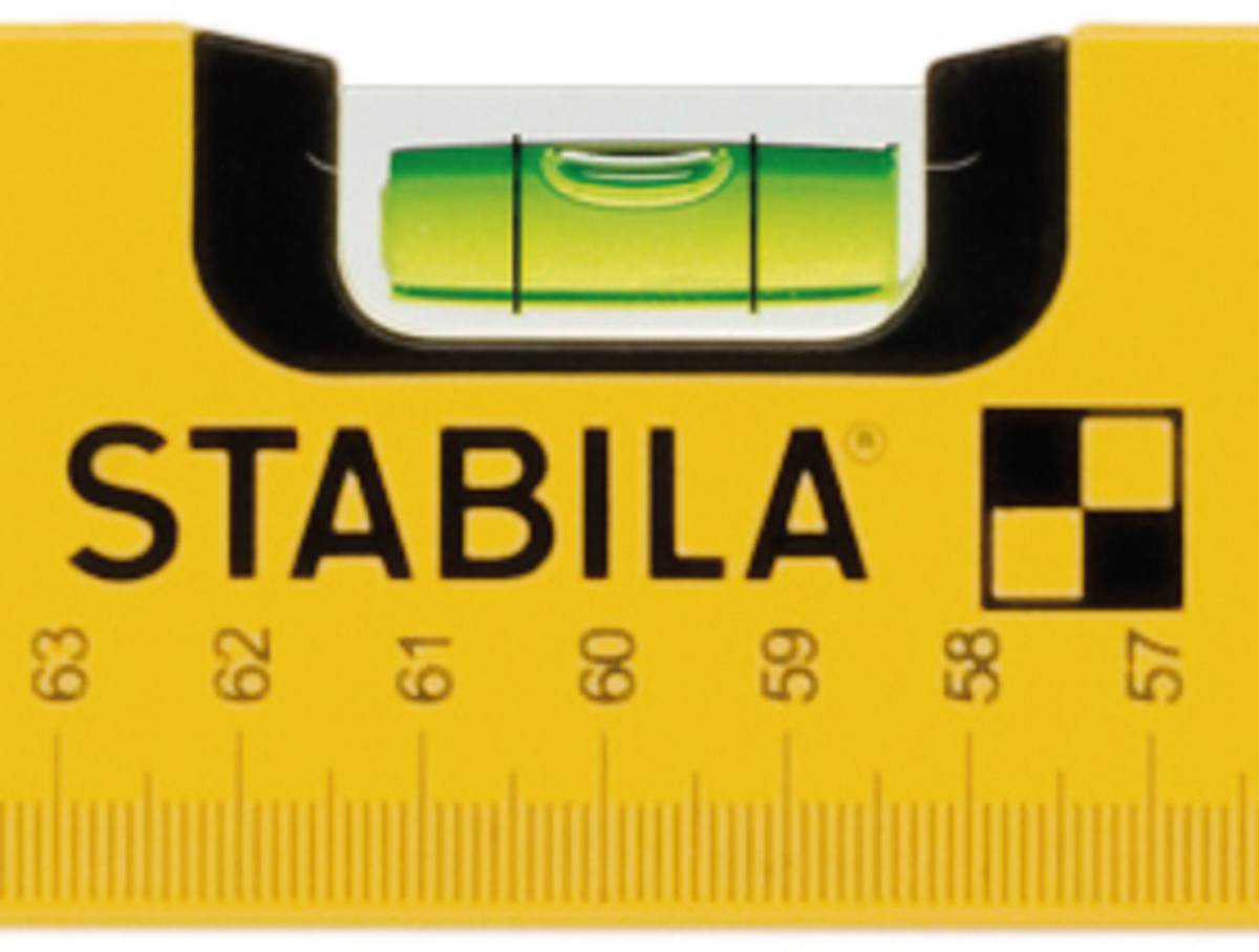 Spirit level with a yellow casing and the inscription 'STABILA', showing correct alignment through the centred bubble.