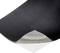 A black, curved mat surface with visible grey underside.