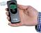 A hand is holding a breathalyser with a digital display showing '0.00'. The device is ready for use and indicates no alcohol levels.