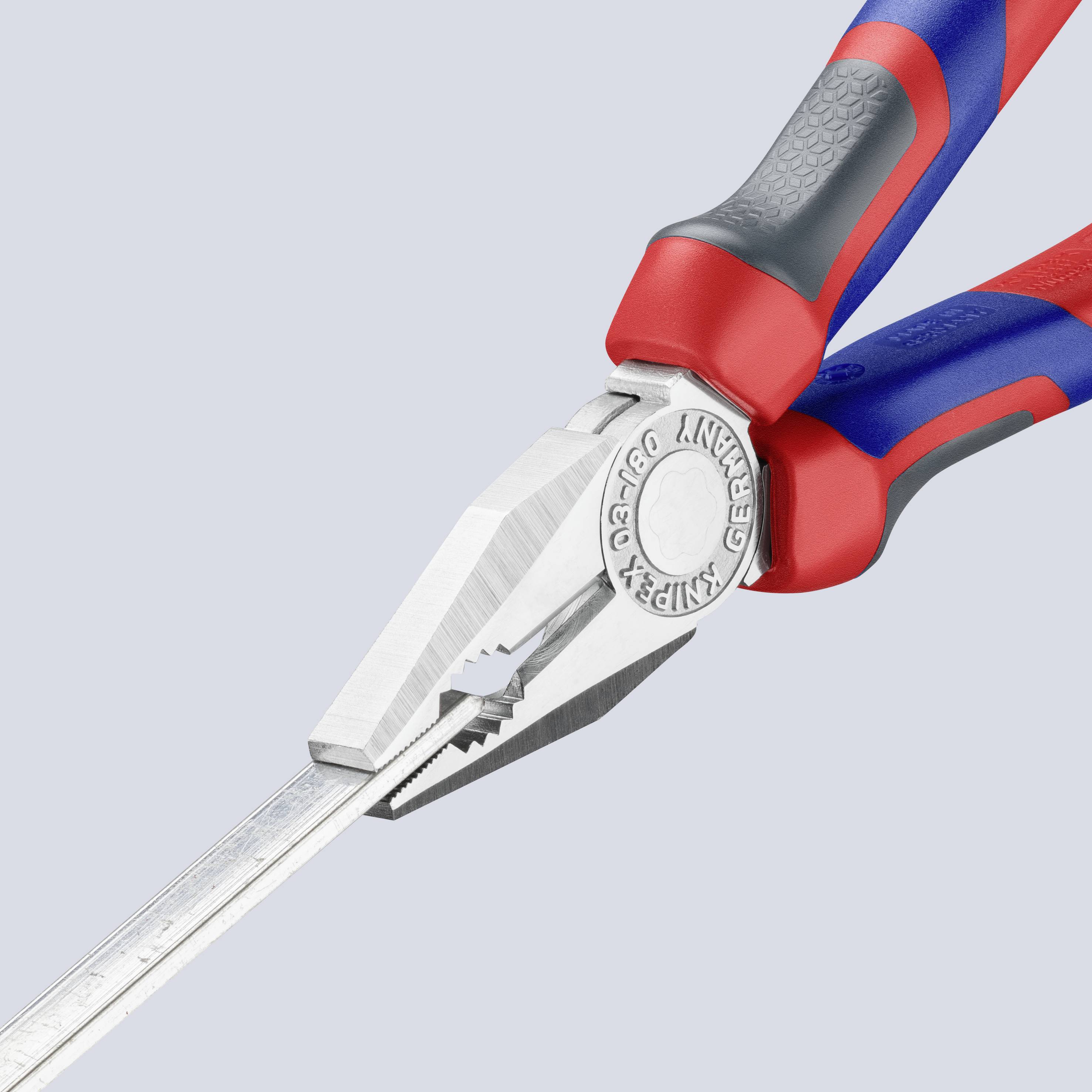 A combination pliers with a red and blue handle firmly grips a metal ruler.