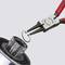 'Pliers securely grip an industrial metal component. Precise tool usage demonstrated in technical application.'