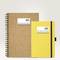 Two notebooks: on the left, a larger one with a cork cover, on the right, a smaller yellow one with diagonal lines. Both are labelled 'Project Notes'.