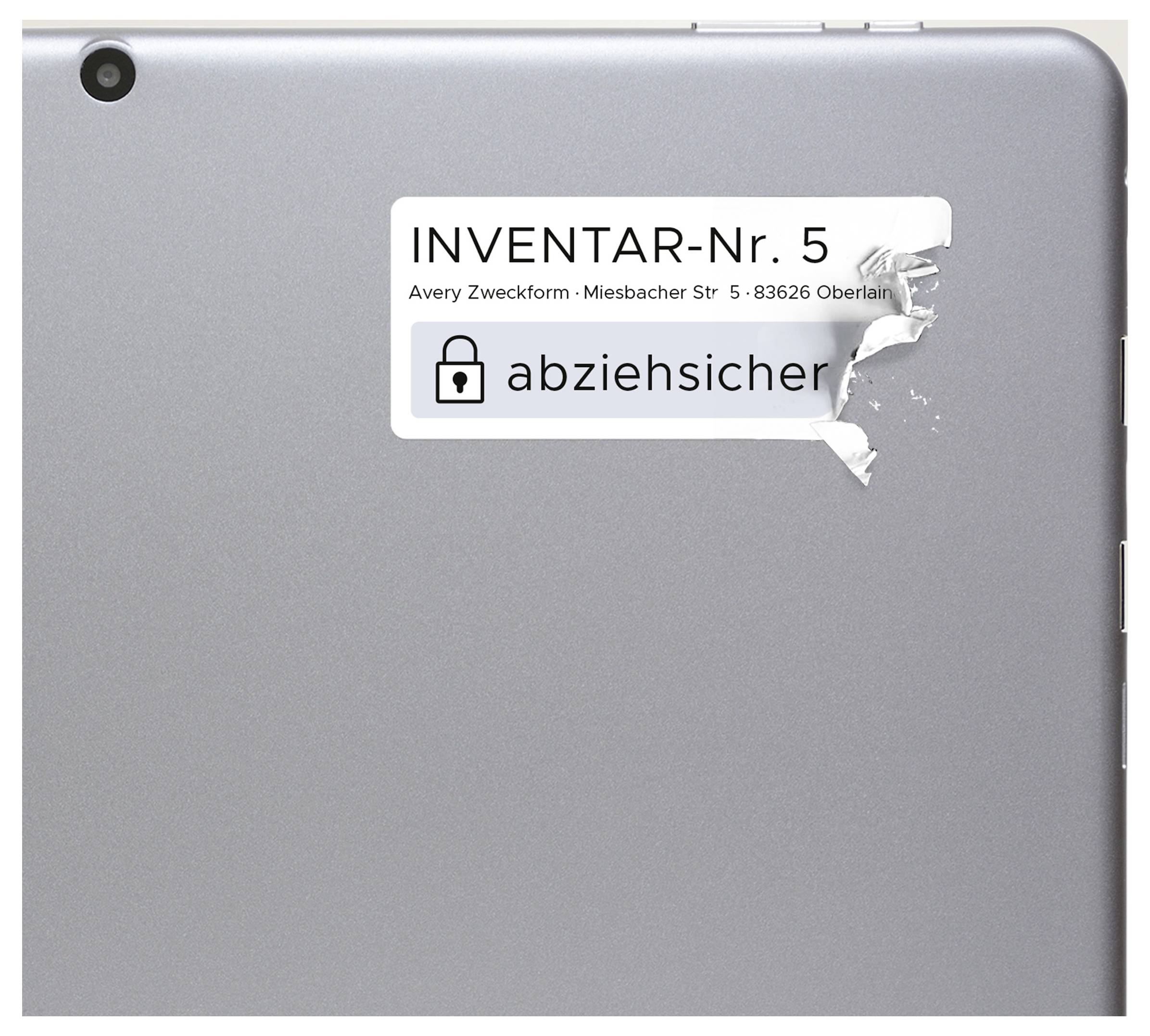 Back of a silver tablet with a removable inventory label 'INVENTORY No. 5', partially damaged.