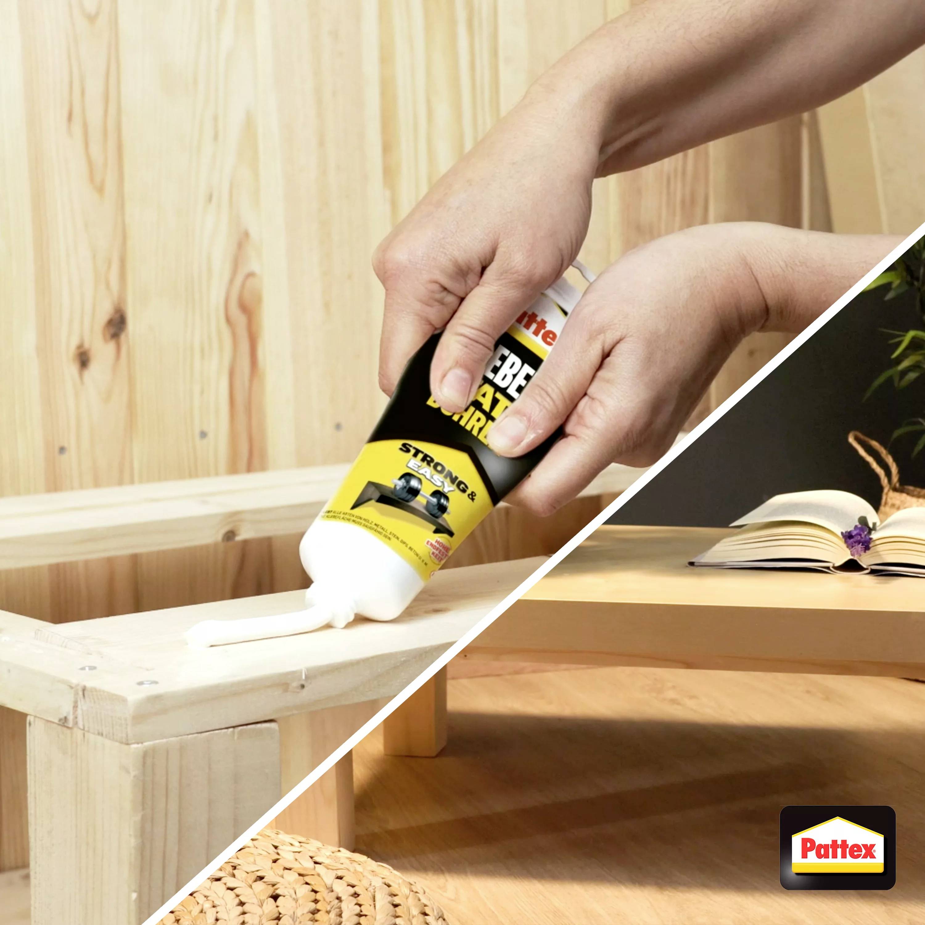 A person is applying glue to a wooden corner, possibly for craft work or repairs.