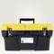 A yellow toolbox with black edges and a white inventory label with the number '123456' on the front.