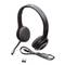 Black USB headset with adjustable microphone and soft ear cushions, USB cable and USB receiver placed beside it on white background.