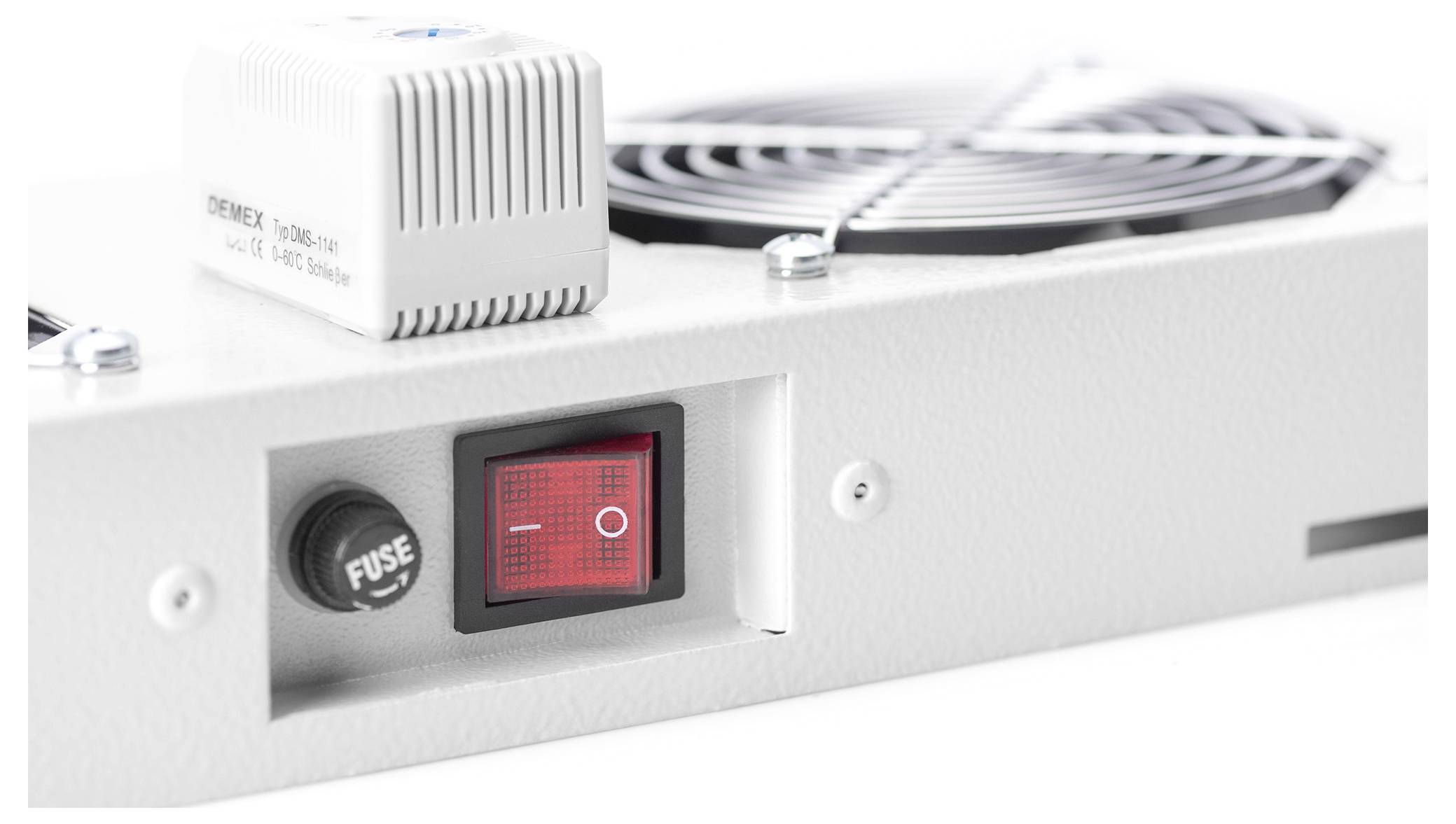 'White box fan with grille and red power switch labeled "I" and "O" on control panel, accompanied by a fuse compartment, on white backdrop.'