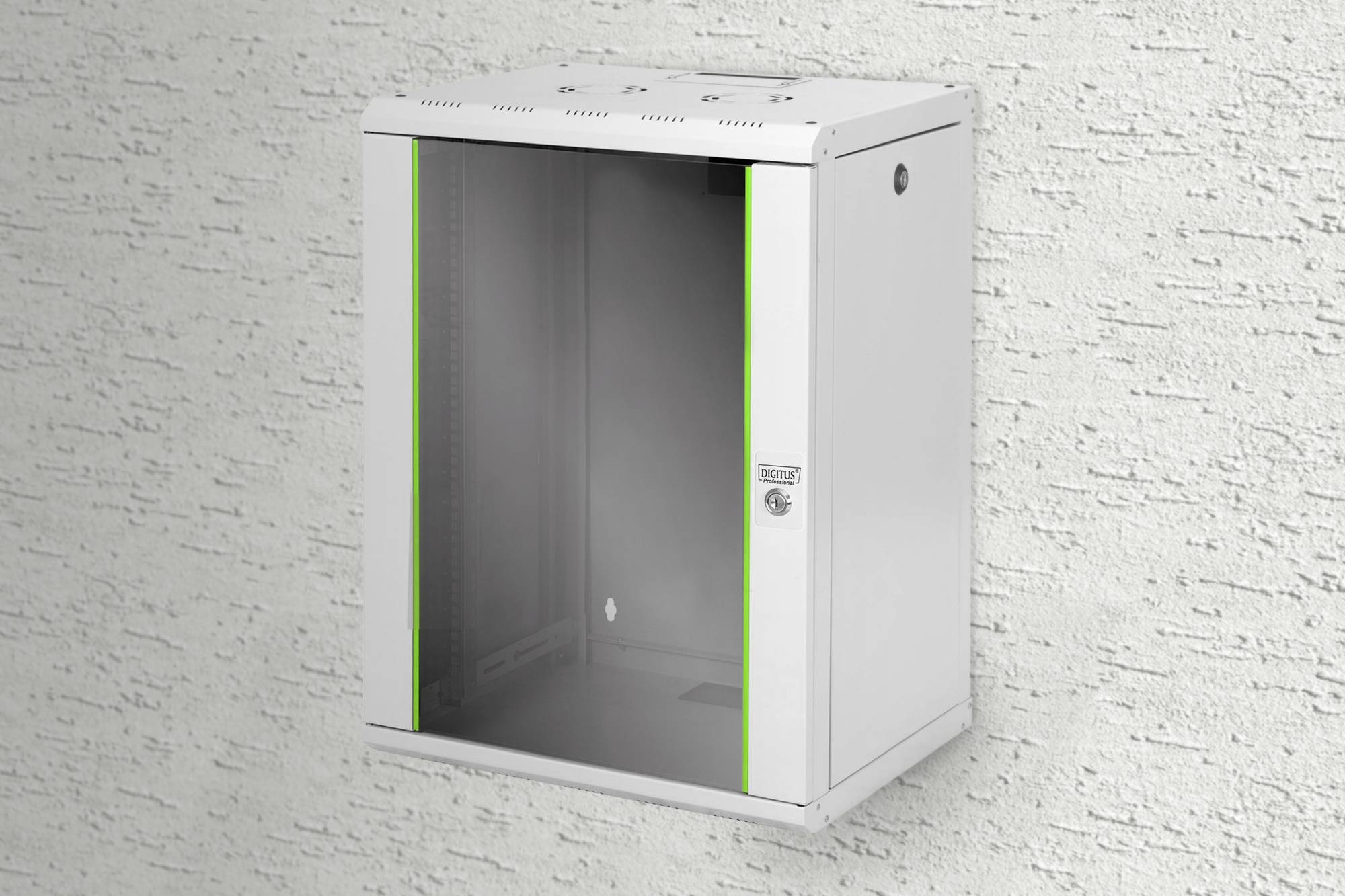 A white wall-mounted enclosure with a glass front and green stripes on the sides, mounted on a textured white wall.