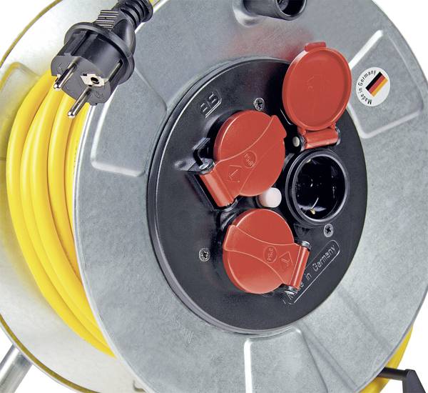 Yellow power cable reel with two red socket covers, manufactured in Germany.