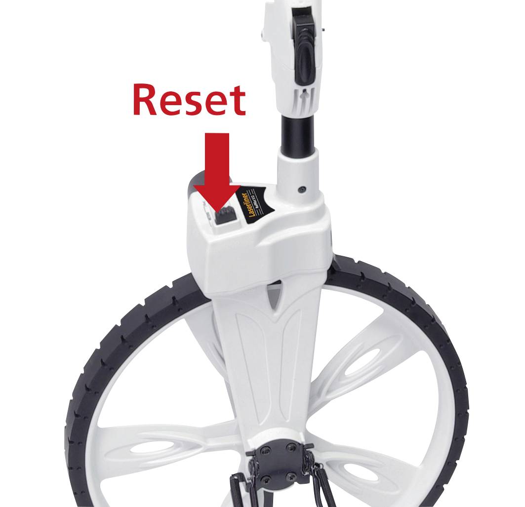 'Reset button on a white counter wheel. Arrow pointing to the reset button. Wheel with a black tyre and white spokes.'