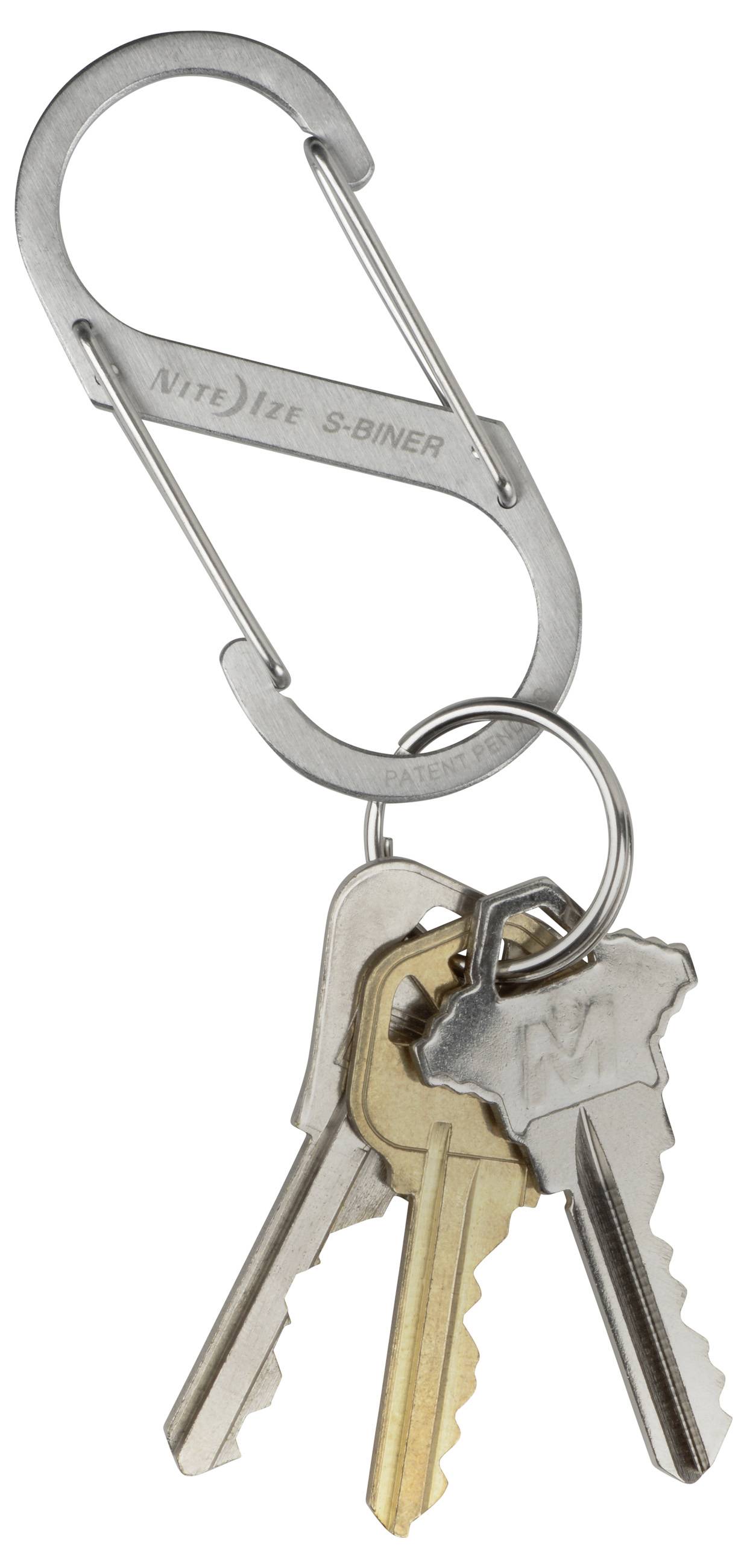 A silver S-biner keychain holding three keys, including one brass and two silver-colored keys.