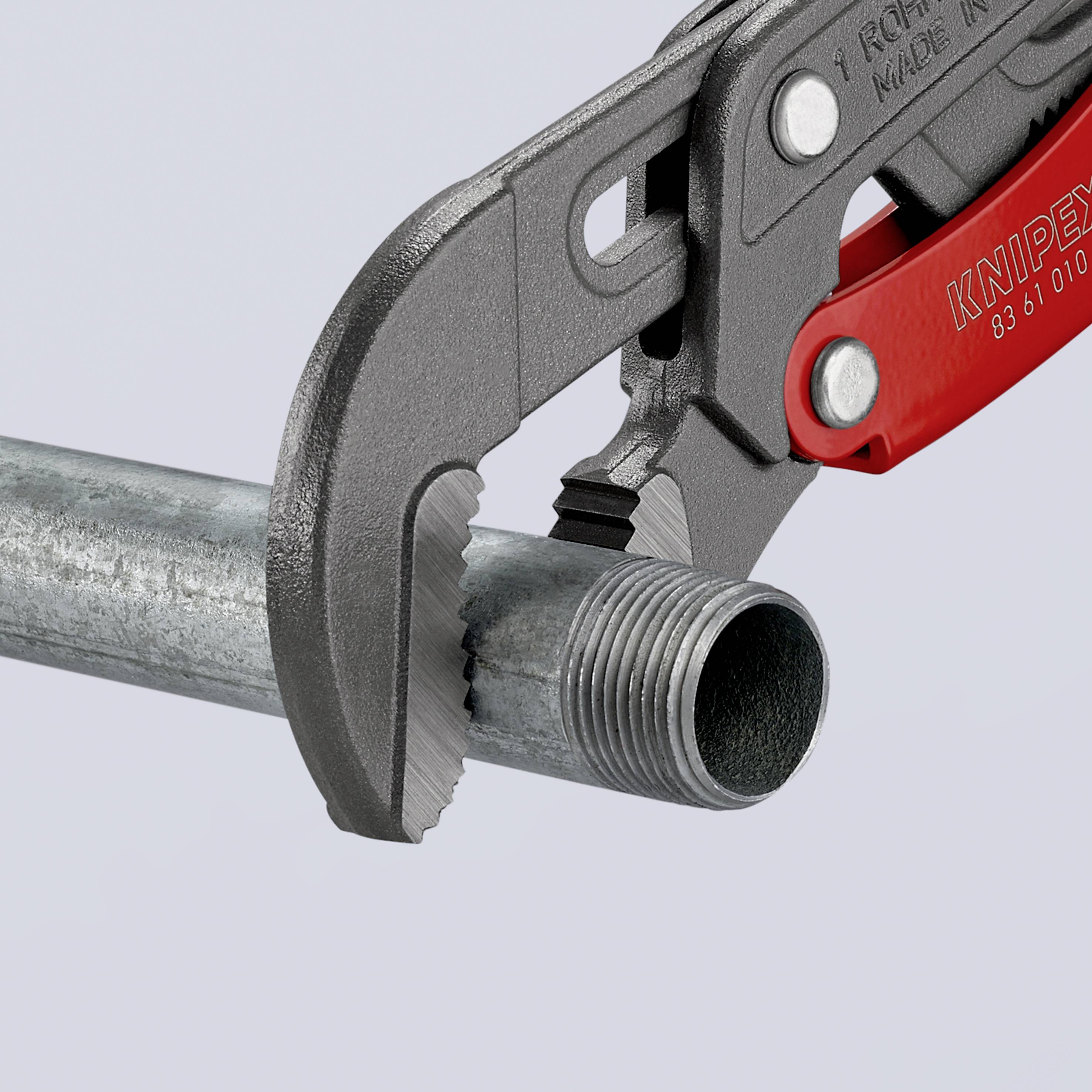 A pipe wrench grips a metal pipe. It demonstrates the ability to hold pipes securely. Background is monochrome.